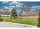 Well maintained yard with vibrant lawn and mature trees at 12821 Gloria Dr, Fishers, IN 46037