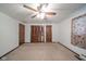 Spacious bedroom featuring neutral carpet, white walls, and a ceiling fan with lighting at 1507 Lynnwood Dr, Anderson, IN 46012