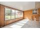 Sunroom featuring large windows and unique patterned flooring at 1507 Lynnwood Dr, Anderson, IN 46012