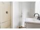 Bathroom with a shower, sink, and window at 1510 Asbury St, Indianapolis, IN 46203