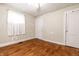 A bedroom featuring hardwood floors, two closets and natural light from an exterior window at 1510 Asbury St, Indianapolis, IN 46203