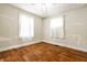 Cozy bedroom with hardwood floors and natural light streaming through the windows at 1510 Asbury St, Indianapolis, IN 46203