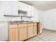 Kitchen featuring light wood cabinets, a stainless steel faucet, and a granite countertop at 1510 Asbury St, Indianapolis, IN 46203