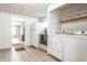 Kitchen featuring a refrigerator, oven, washer, and dryer near the doorway to the living room at 1510 Asbury St, Indianapolis, IN 46203