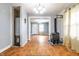 Open-concept living room features a wood-burning stove and hardwood floors at 1510 Asbury St, Indianapolis, IN 46203