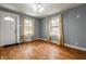 Bright living room with natural light and hardwood floors, showcasing a neutral color palette and spacious layout at 1510 Asbury St, Indianapolis, IN 46203