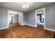 Open-concept living room with hardwood floors, showcasing the spaciousness and flow into other rooms of the house at 1510 Asbury St, Indianapolis, IN 46203
