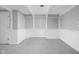 Basement area with drop ceiling, neutral paint, and white wainscotting at 157 E 61St St, Indianapolis, IN 46220