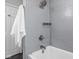 Tiled shower and tub with chrome fixtures at 157 E 61St St, Indianapolis, IN 46220
