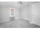Neutral bedroom with natural light through window and classic door, offering a calm and peaceful space at 157 E 61St St, Indianapolis, IN 46220