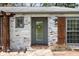 Front exterior of home showing the glass door, window and sconce at 157 E 61St St, Indianapolis, IN 46220