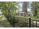 Exterior of home with an iron fence and tree lined street at 157 E 61St St, Indianapolis, IN 46220