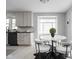 Eat-in kitchen with a marble countertop table and modern chairs at 157 E 61St St, Indianapolis, IN 46220