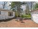 Cozy brick patio with outdoor seating, great for enjoying the backyard and lush greenery at 157 E 61St St, Indianapolis, IN 46220