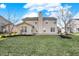 Landscaped backyard and patio with view of the home's rear exterior at 16271 Ambia Cir, Westfield, IN 46074