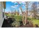 Well-maintained backyard with lush grass, mature trees, and stone patio at 16271 Ambia Cir, Westfield, IN 46074