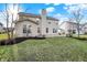 Spacious backyard with manicured lawn and stone patio, perfect for outdoor entertaining at 16271 Ambia Cir, Westfield, IN 46074