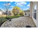 Spacious backyard with a flagstone patio, lush lawn, and mature trees offers a peaceful outdoor living space at 16271 Ambia Cir, Westfield, IN 46074