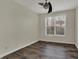 Cozy bedroom with wood flooring and a single window offering natural light at 16271 Ambia Cir, Westfield, IN 46074