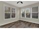 Sun-filled bedroom featuring three large windows and wood flooring at 16271 Ambia Cir, Westfield, IN 46074
