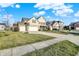 Suburban home showcasing a large front yard, driveway, and a two-car garage at 16271 Ambia Cir, Westfield, IN 46074