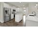 Modern kitchen with stainless steel appliances, white cabinetry, and a center island at 16271 Ambia Cir, Westfield, IN 46074
