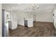 Spacious living room with white cabinets, modern light fixture and beautiful flooring at 16271 Ambia Cir, Westfield, IN 46074