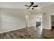 Large living room with hardwood flooring, ceiling fan and arched doorway at 16271 Ambia Cir, Westfield, IN 46074