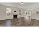 Spacious living room features a fireplace, wood floors, and abundant natural light at 16271 Ambia Cir, Westfield, IN 46074