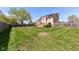 Large backyard featuring a well-maintained lawn, wooden deck, and a fence, perfect for outdoor activities at 1652 Valley Brook Dr, Indianapolis, IN 46229