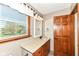 Bathroom features a granite countertop, wood cabinets, and natural light from the large window above the sink at 1652 Valley Brook Dr, Indianapolis, IN 46229