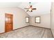 A spacious bedroom features neutral walls, plush carpeting, and a vaulted ceiling with a ceiling fan at 1652 Valley Brook Dr, Indianapolis, IN 46229