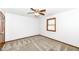 A cozy bedroom features neutral walls, plush carpet, a ceiling fan and a window offering natural light at 1652 Valley Brook Dr, Indianapolis, IN 46229