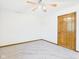 Bright bedroom with ceiling fan and closet at 1652 Valley Brook Dr, Indianapolis, IN 46229