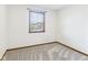A room with a gray carpet and a window with a view of the neighborhood at 1652 Valley Brook Dr, Indianapolis, IN 46229