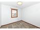 Neutral bedroom with carpet, baseboard trim, electrical outlets, and a window with exterior view at 1652 Valley Brook Dr, Indianapolis, IN 46229