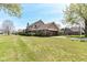 Charming home with a covered porch, brick detailing, a two-car garage and a well-kept lawn at 1652 Valley Brook Dr, Indianapolis, IN 46229