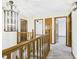 Upstairs hallway with doors leading to bedrooms at 1652 Valley Brook Dr, Indianapolis, IN 46229
