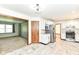 Spacious kitchen featuring stainless steel appliances and an open view to the carpeted living room at 1652 Valley Brook Dr, Indianapolis, IN 46229