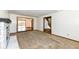 Spacious living room featuring a fireplace, plush carpet, and views to connecting rooms at 1652 Valley Brook Dr, Indianapolis, IN 46229