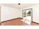 Inviting living room featuring wood floors, stylish lighting and sliding door access to a deck at 1652 Valley Brook Dr, Indianapolis, IN 46229