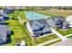 Aerial view of home and property, complete with a pond and lush landscaping at 16683 Alex Dr, Noblesville, IN 46060