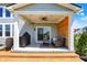 Covered back patio with comfortable seating, a grill, and a ceiling fan for outdoor enjoyment at 16683 Alex Dr, Noblesville, IN 46060