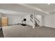 Finished basement features stairs, a sauna, and ample space for a home gym or recreation area at 16683 Alex Dr, Noblesville, IN 46060