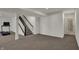 Spacious finished basement with neutral carpet, stairs, and easy access to an adjacent bathroom at 16683 Alex Dr, Noblesville, IN 46060