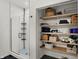 This bathroom showcases a spacious glass shower and an organized closet with shelving at 16683 Alex Dr, Noblesville, IN 46060