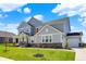 Charming two-story home features a well-kept lawn, brick accents and an attached garage at 16683 Alex Dr, Noblesville, IN 46060
