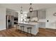 Modern kitchen with a large island, stainless steel appliances and pendant lights at 16683 Alex Dr, Noblesville, IN 46060
