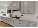 Kitchen featuring updated cabinetry, light countertops, and stainless appliances at 16683 Alex Dr, Noblesville, IN 46060