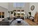 Open living room with high ceilings, large windows, and modern furnishings at 16683 Alex Dr, Noblesville, IN 46060